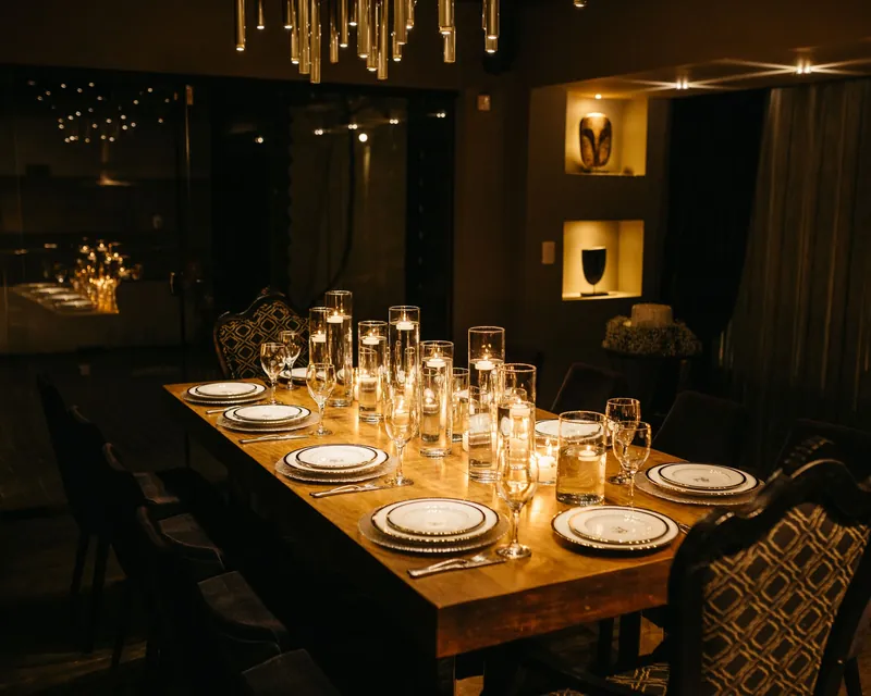 A long table set by candlelight