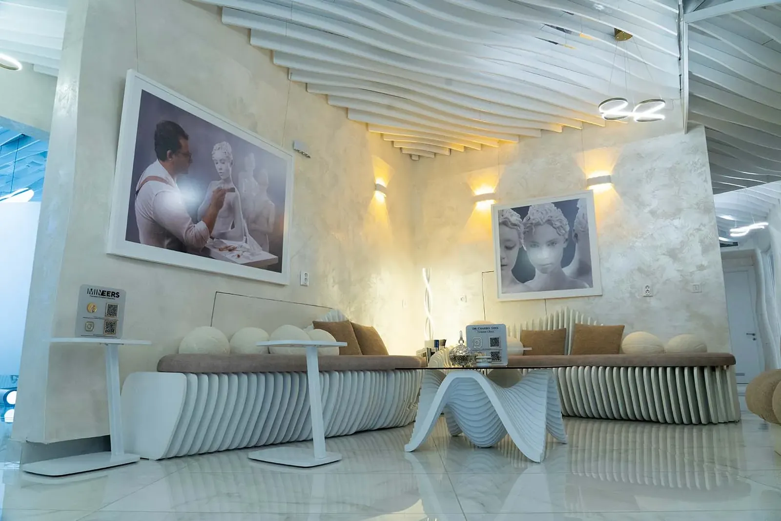 The lounge at Mineers in Sofia: sculpted white benches on a white marble floor