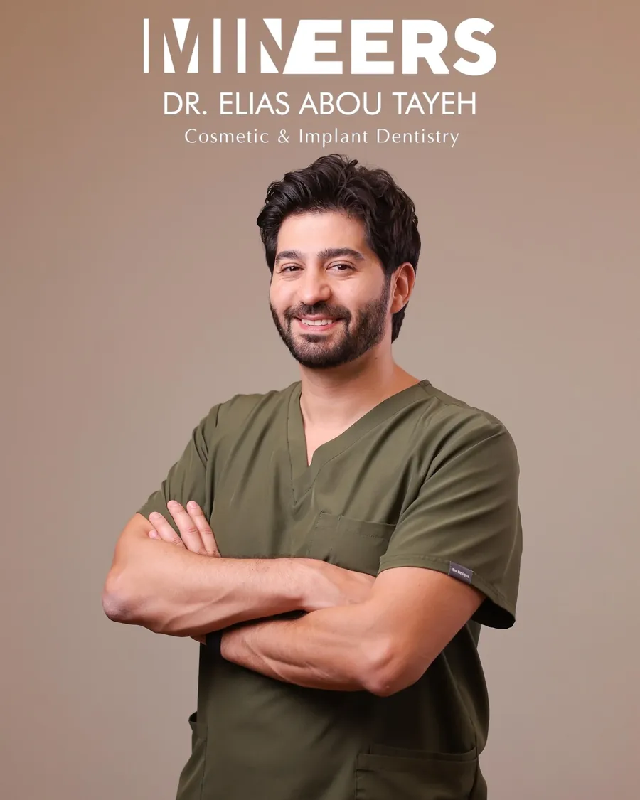 Portrait of Dr. Elias Abou Tayeh in the clinic’s olive scrubs
