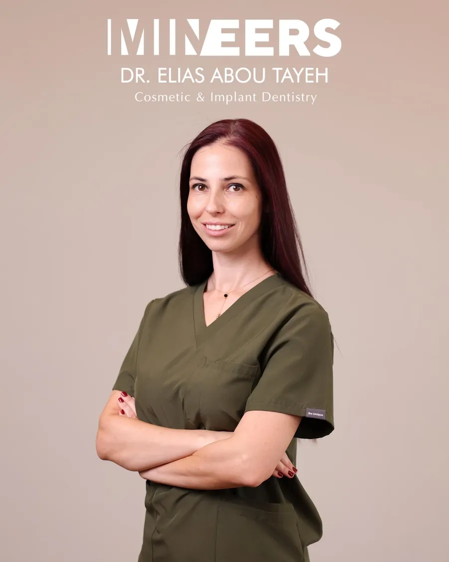 Portrait of Dr. Milena Ilieva in the clinic’s olive scrubs