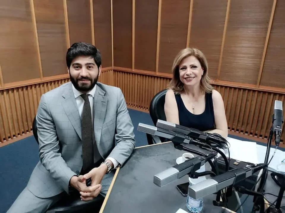 Dr. Elias Abou Tayeh in a radio studio interview